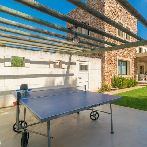 Get competitive over a game of ping pong in the garden 