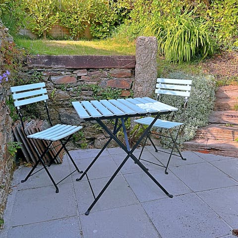 Sip a morning coffee, or an evening glass of wine, on the cute and cosy patio