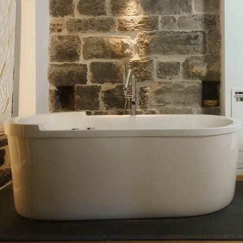 Enjoy a luxurious soak in the Jacuzzi bathtub