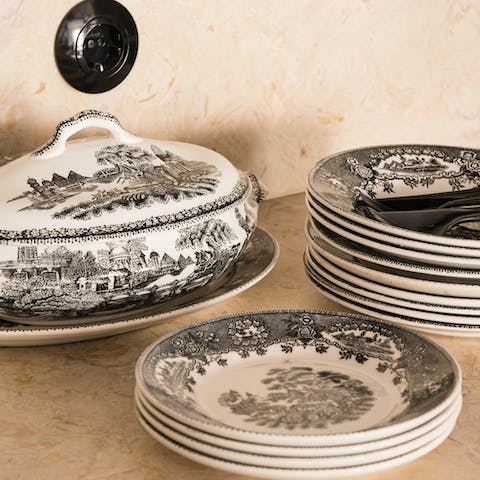 Dine from striking black and white willow pattern crockery