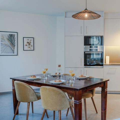 Enjoy dining on the solid wooden table in the living space