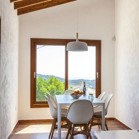 Enjoy a home-cooked dinner inside on cooler evenings, admiring the view from the large window