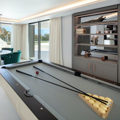 Challenge your loved ones to a game of billiards