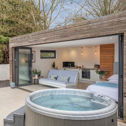 Enjoy a long soak in the private hot tub after walks in the Sussex Downs