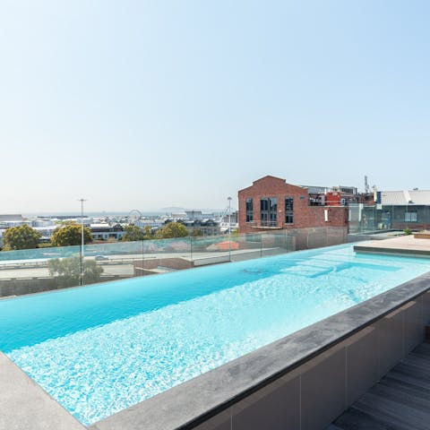 Soak up some sun while swimming laps in the communal rooftop pool