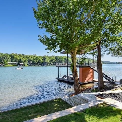 Walk down to the water's edge and set sail on a kayak or relax on a lounger