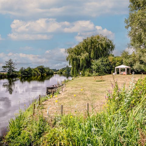 Enjoy lazy riverside strolls or fishing from the water's edge