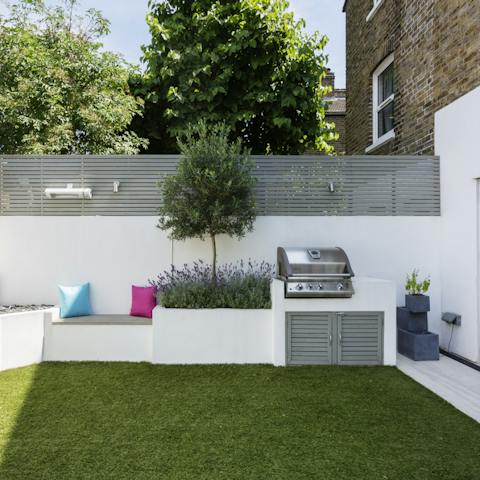 Host a barbecue in the sunny garden while kids play on the astroturf