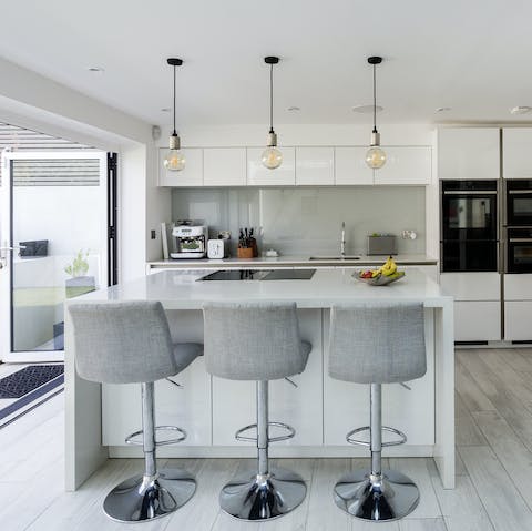 Cook up a storm in the sleek kitchen – the bi-fold doors and skylights provide plenty of natural light