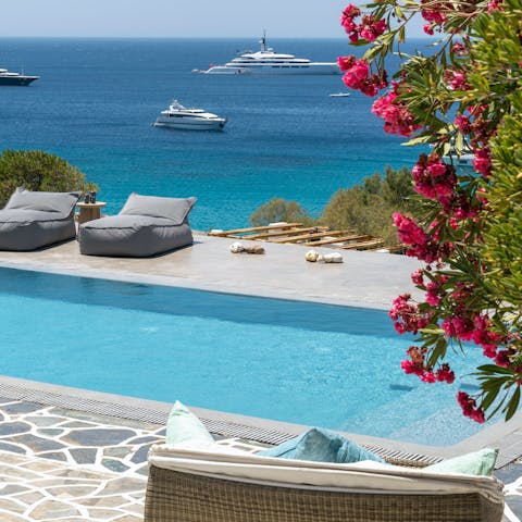 Enjoy idyllic views across Platis Gialos Bay from the pool