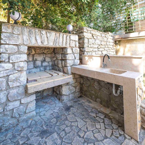 Barbecue to your heart's content in the outdoor kitchen