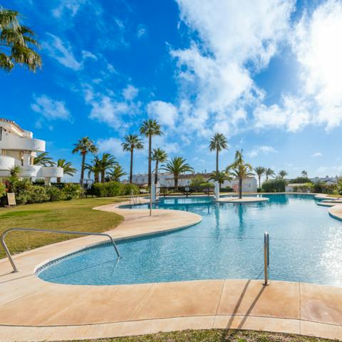 Enjoy a dip in the communal pool as the Spanish sun shines down