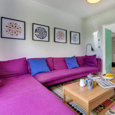Get cosy on the corner sofa with a book in hand, after the day's activities on the beach