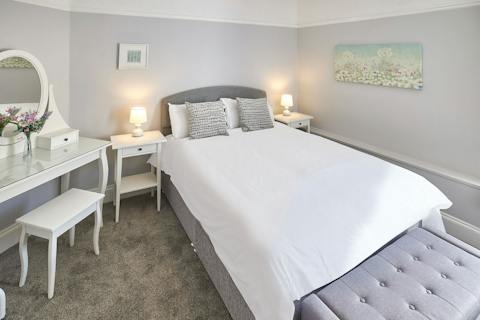 Enjoy a restful night's sleep in the charming bedroom