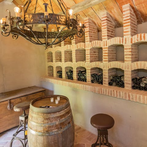 Enjoy a tipple of aged Spanish wine in the wine cellar 