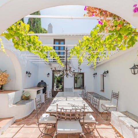 Dine alfresco at one of the many outdoor dining areas found throughout the home