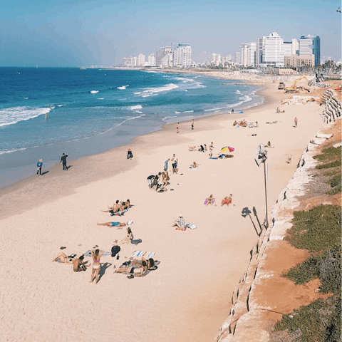 Take the fifteen-minute stroll to Aviv Beach and relax on the golden sands