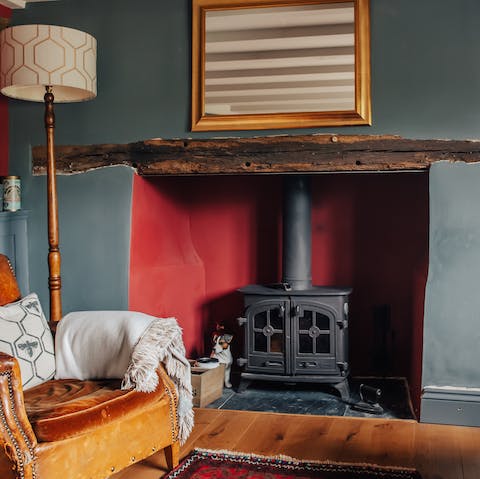 Cosy up with a book by the classic wood-burning stove