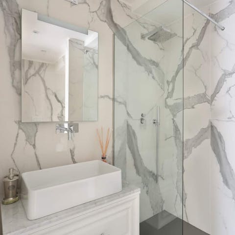 Get ready for an evening out in Florence in the gorgeous marble-clad bathroom