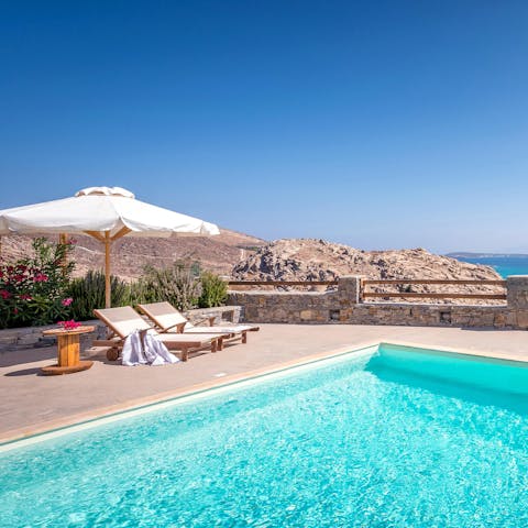 Stretch out on the sun loungers by the inviting pool
