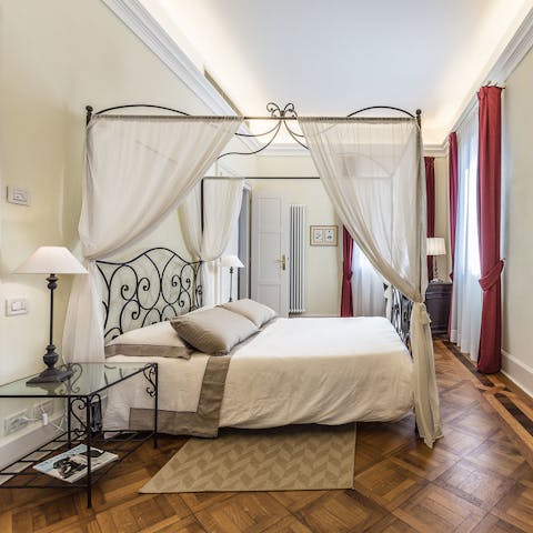 Wake up in the four-poster bed, ready for more Venice sightseeing