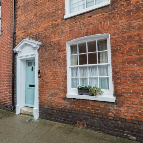Arrive in style, at the quaint front door of your red brick home