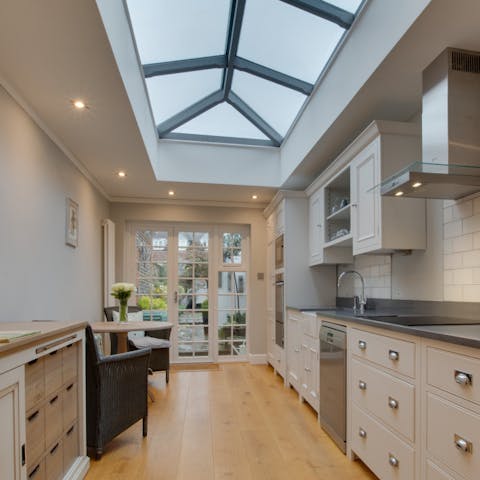Prepare a supper with fresh, local produce below the kitchen skylight