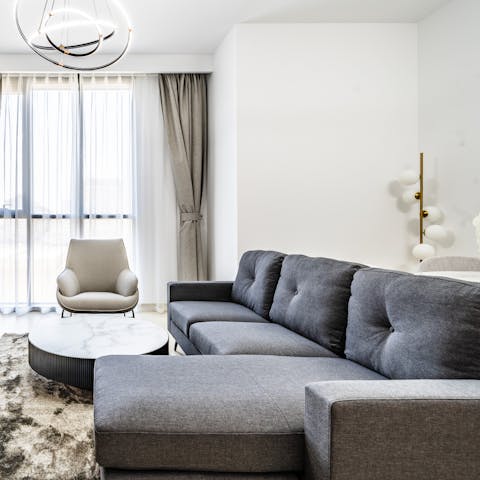 Stretch out on the comfy L-shaped sofa after long days at the beach