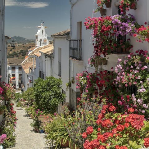 Have a stroll around the flower-filled streets of El Gastor, a five-minute drive away