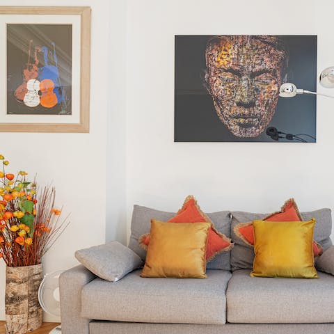 Take in the home's eclectic artwork and colourful decor