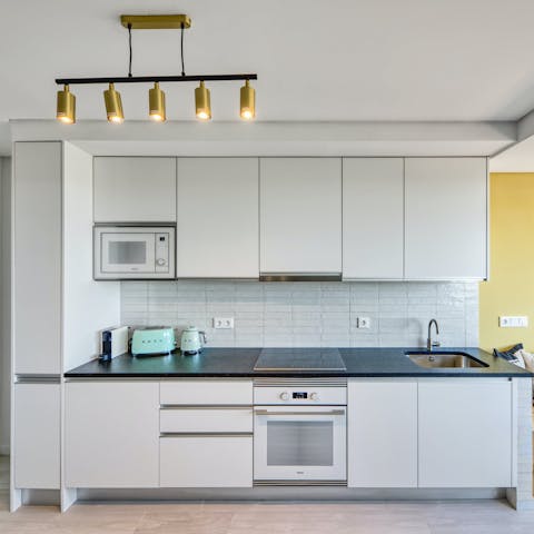 Rustle up a bite to eat in the sleek, modern kitchen