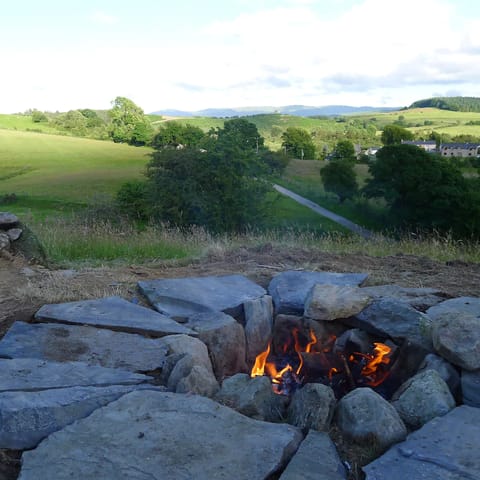 Gather around the firepit after enjoying an alfresco meal on the outdoor terrace