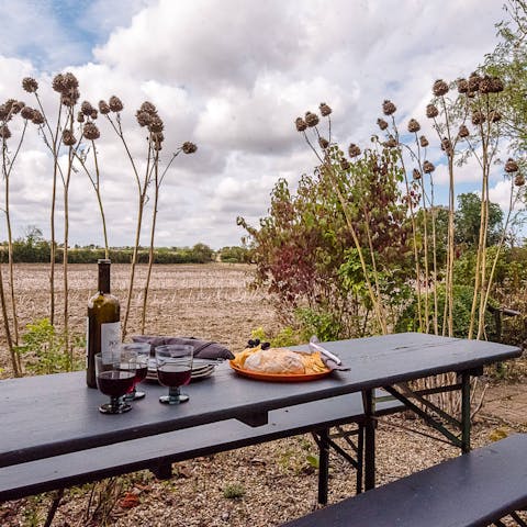 Take in scenic views over the surrounding wildlife from the alfresco dining area 