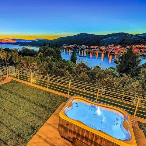 Watch the sunset as you unwind in the jacuzzi
