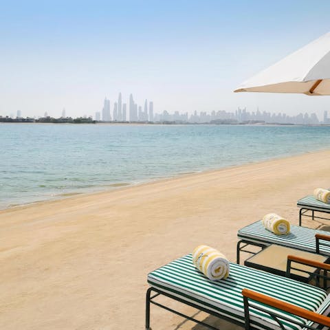 Spend the day relaxing on the private beach shared with the building's residents