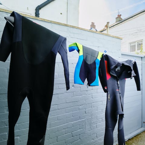 String up the wetsuits to dry in the private courtyard out the backl
