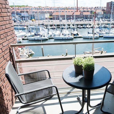 Admire views of the marina from the private balcony