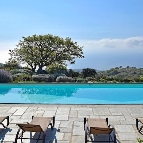 Relax by the pool on the sunbaked veranda