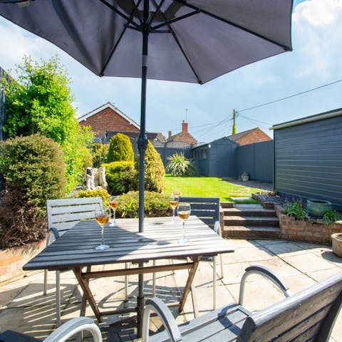 Spend sunny days relaxing on your patio with a glass of wine