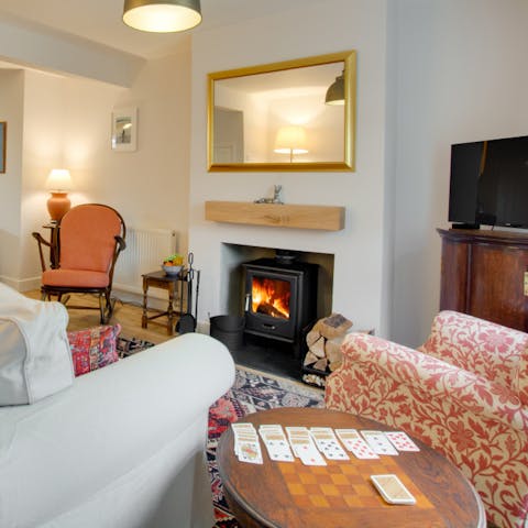 Cosy up under the warmth of the traditional log-burning stove