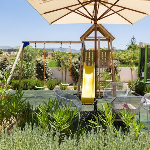 Keep the kids entertained on the swing set and slide