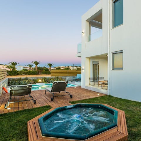 Enjoy a soak in the spa at sunset