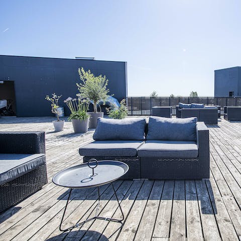 Share a couple of craft beers up on the shared rooftop terrace
