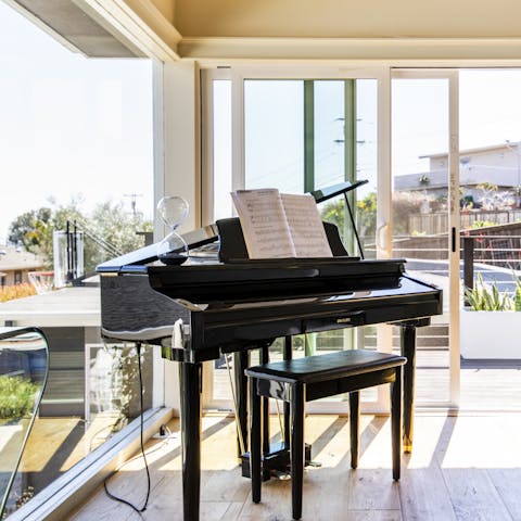 Play a few tunes on the home's piano