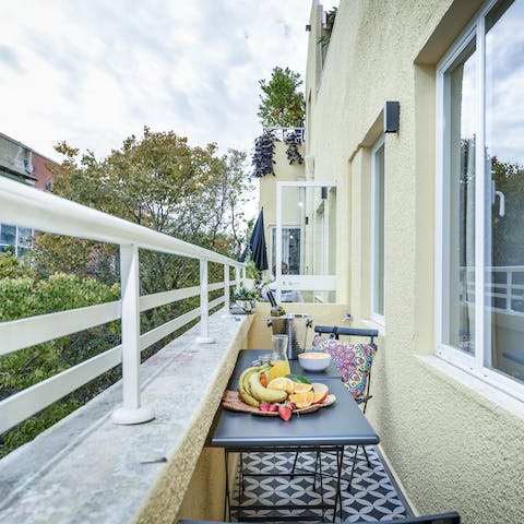 Enjoy an afternoon glass of wine out on your balcony, overlooking the leafy street below