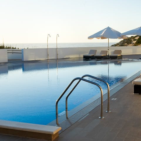 Take in the tranquil sunset views from the pool