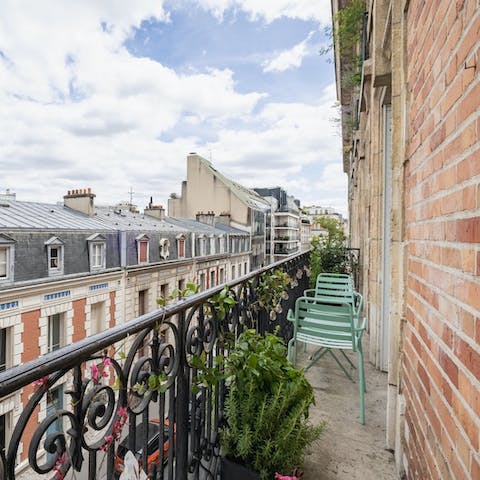 Admire classic Parisian views from the little balcony