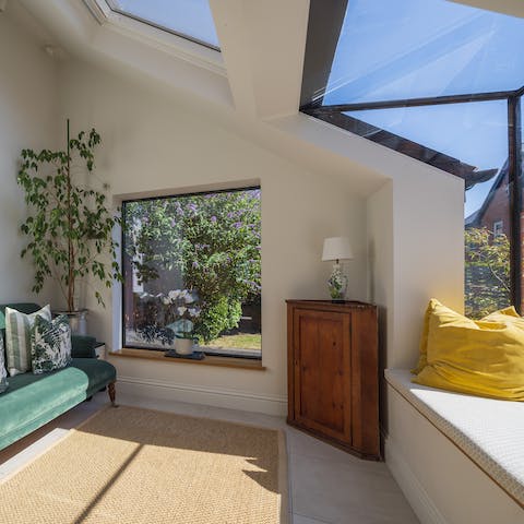 Lose yourself to a good book in the oh-so-contemporary sunroom