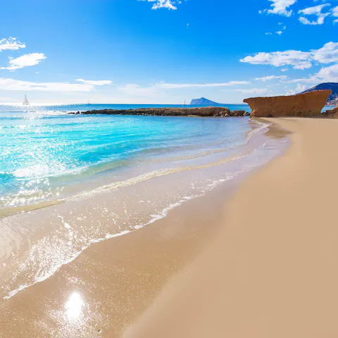 Visit Calpe Cala El Racó beach, a stunning sandy spot a short drive away