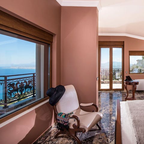 Wake up to knockout sea views from the primary bedroom’s private balcony 